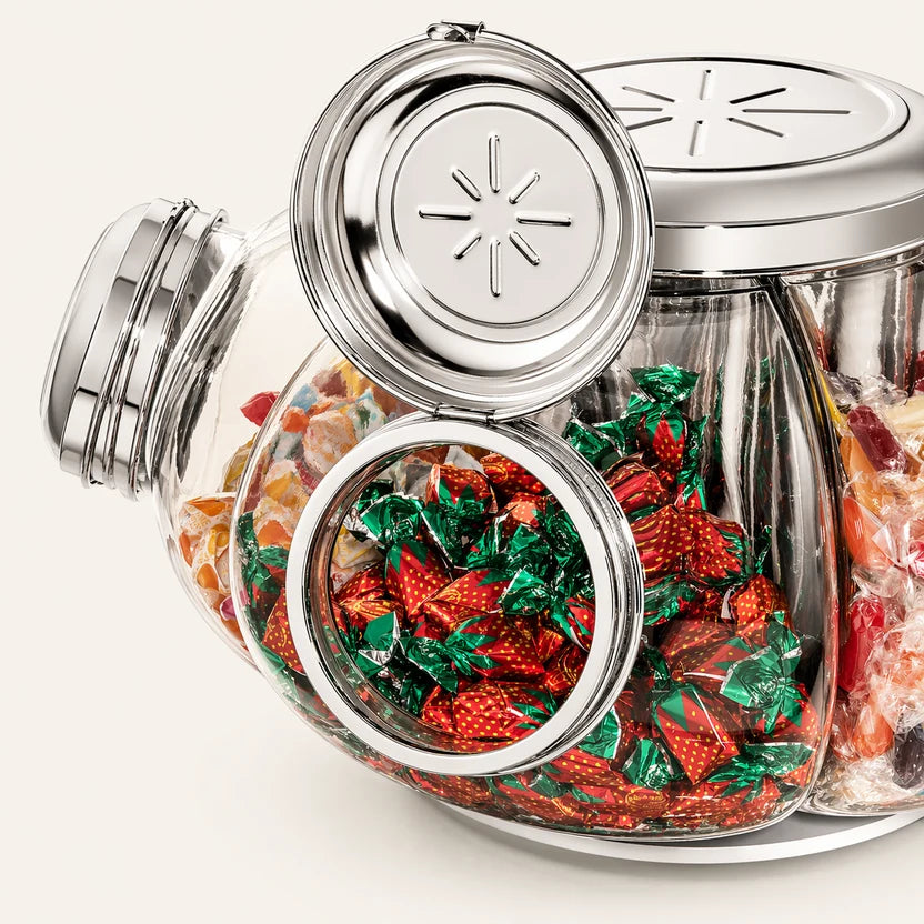 Close detail of open carousel jars and polished lids